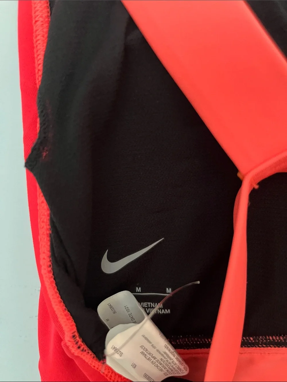 Nike women Colorblock One-Piece in Neon Pink, Coral & Black